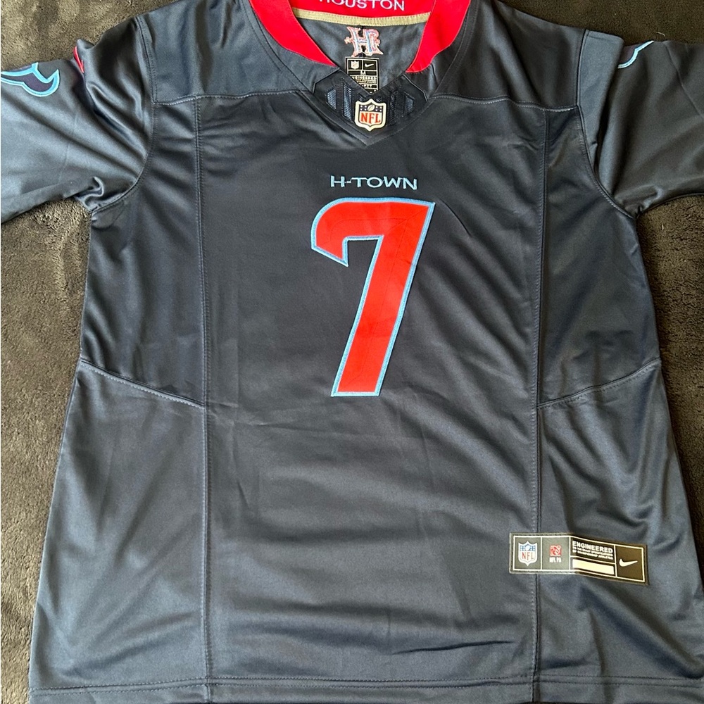 CJ Stroud official NFL H town blue jersey medium.